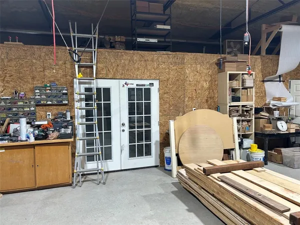 a picture of living room with furniture and floor to ceiling window