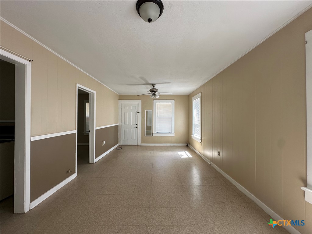 908 Pecan Street Seguin, TX 78155 - Photo 4 of 11 a view of a livingroom with wooden floor and window