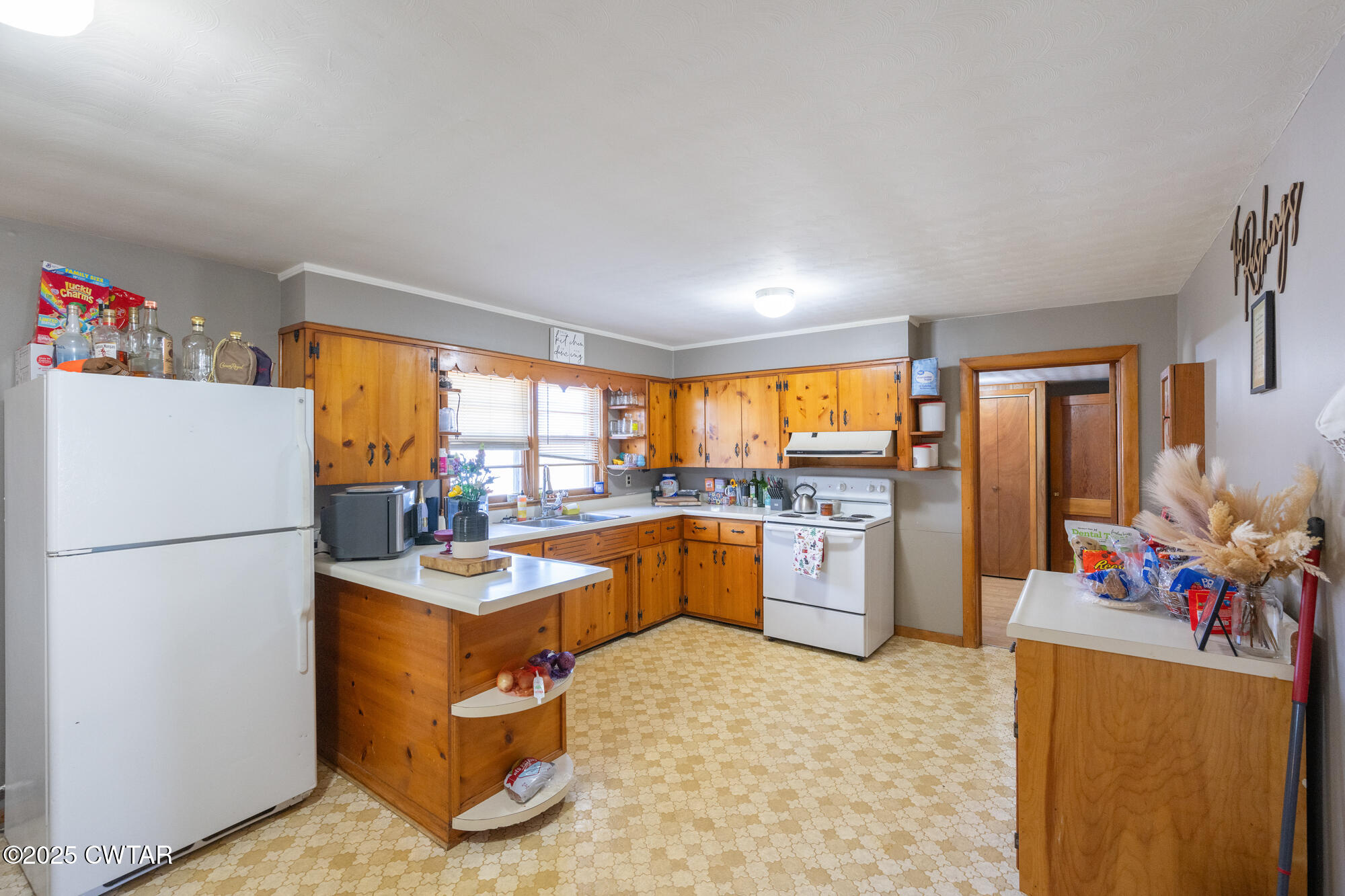 2095 Bible Hill Road Parsons, TN 38363 - Photo 14 of 20 a kitchen with a refrigerator and a stove top oven
