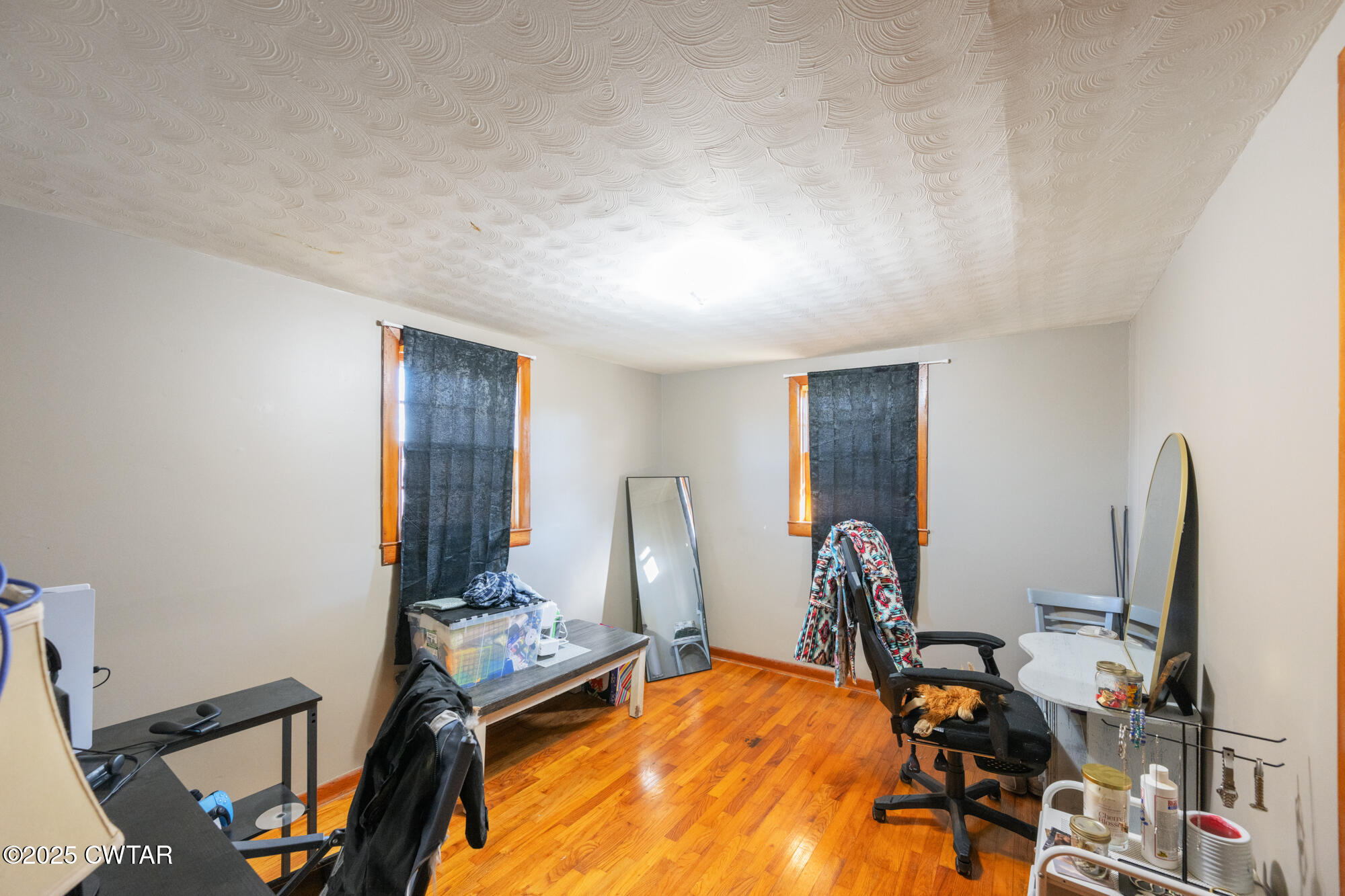 2095 Bible Hill Road Parsons, TN 38363 - Photo 18 of 20 a room with gym equipment and large mirror