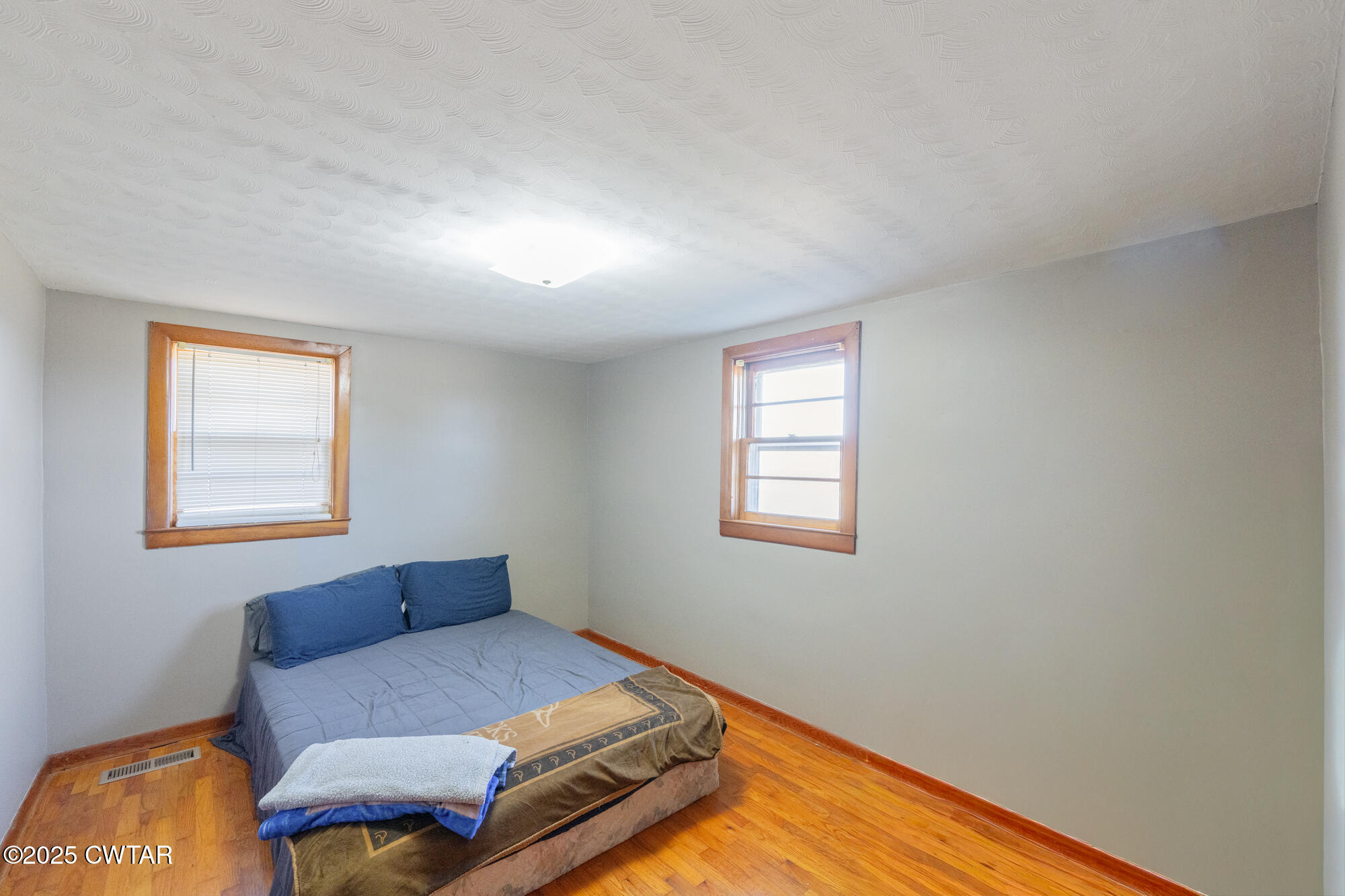 2095 Bible Hill Road Parsons, TN 38363 - Photo 19 of 20 a bedroom with a bed and window