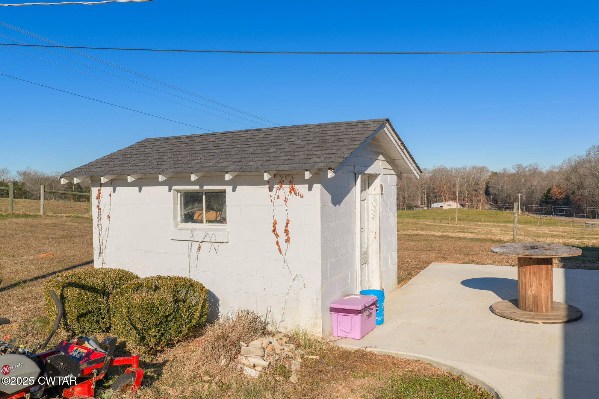 2095 Bible Hill Road Parsons, TN 38363 - Photo 10 of 20 a backyard of a house with seating space