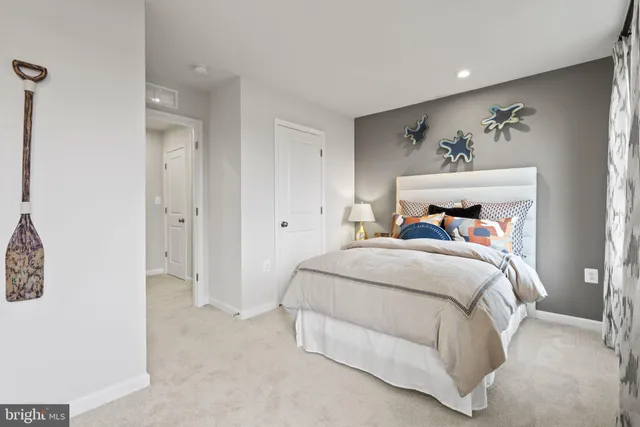 a bedroom with a bed and a painting