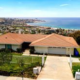 a aerial view of a house with a yard