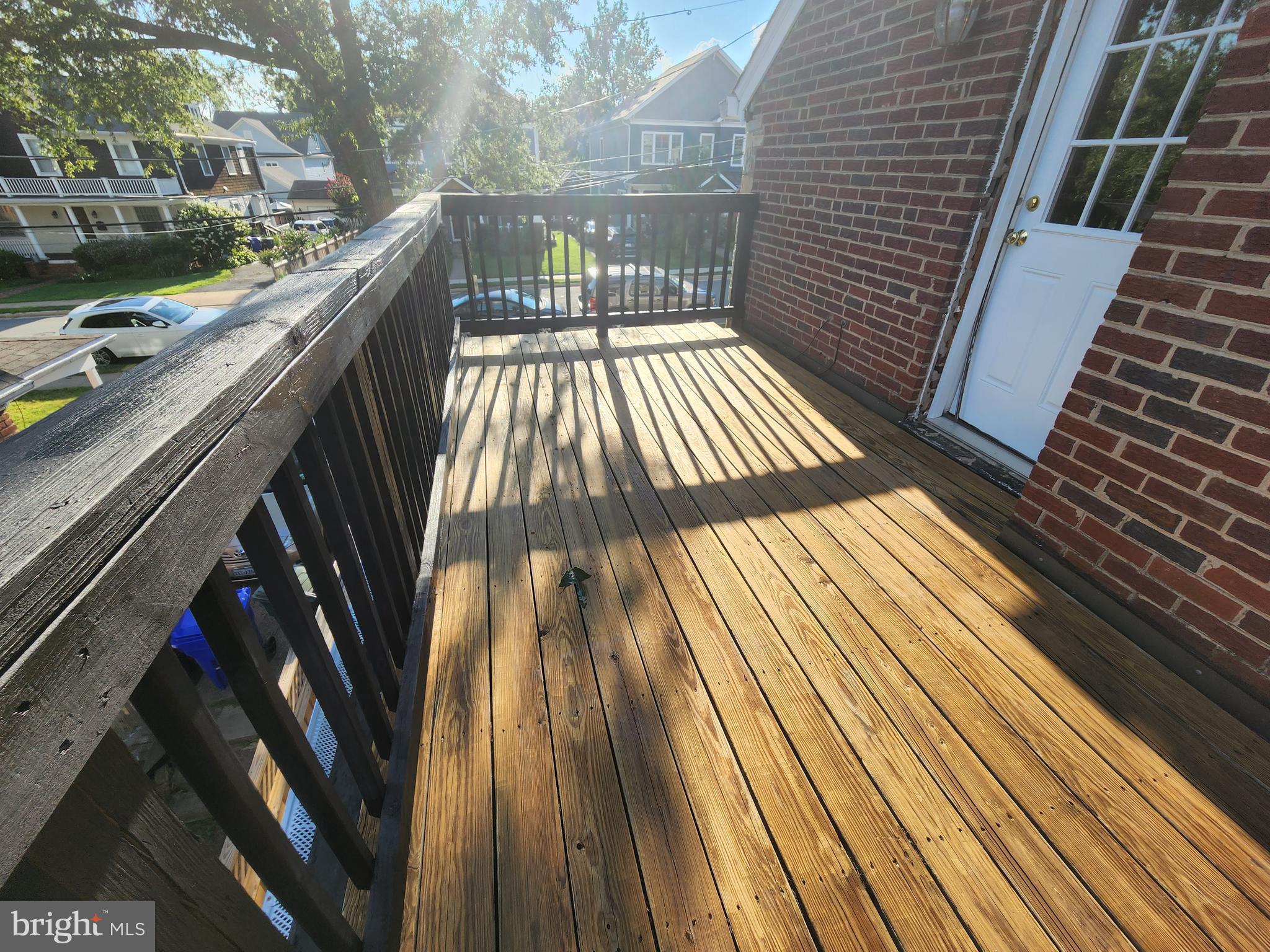 1227 North Utah Street, Unit 3 Arlington, VA 22201 - Photo 21 of 26 a view of balcony with wooden floor and fence