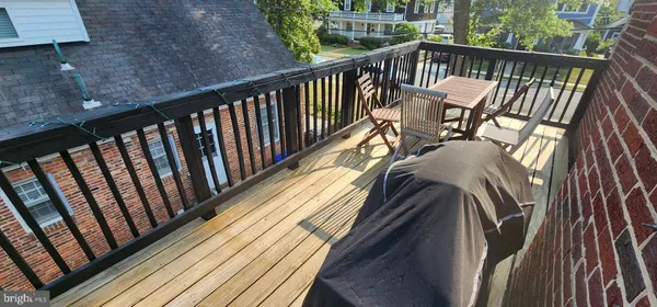 a view of balcony with wooden floor