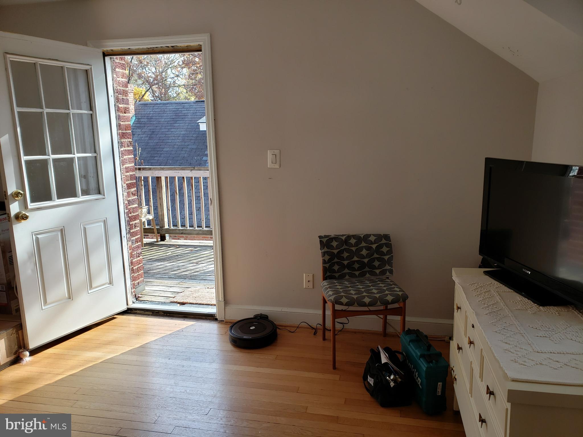 1227 North Utah Street, Unit 3 Arlington, VA 22201 - Photo 4 of 24 a view of a workspace with furniture and a window