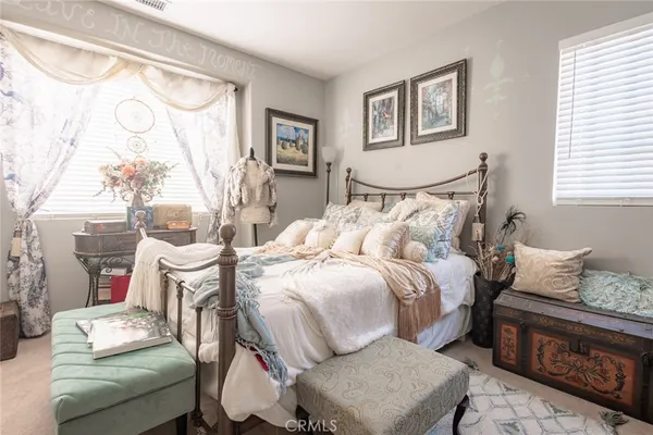 a bed room with furniture and a window