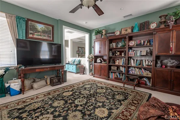 a living room with lots of furniture and a flat screen tv