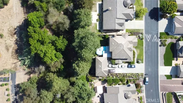 an aerial view of a house with outdoor space