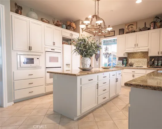 a kitchen with cabinets and window