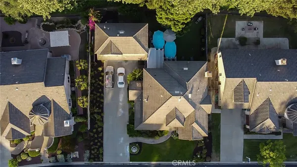 an aerial view of houses with outdoor space