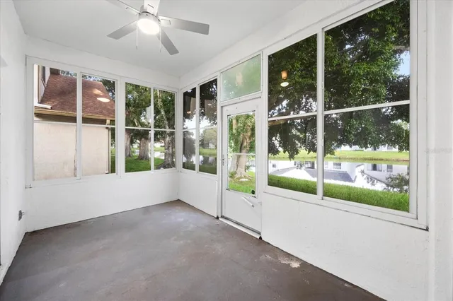 a view of an empty room with windows