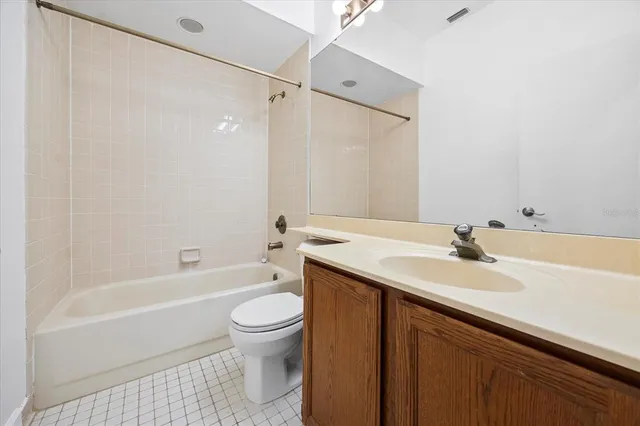 a bathroom with a sink a toilet and a bathtub