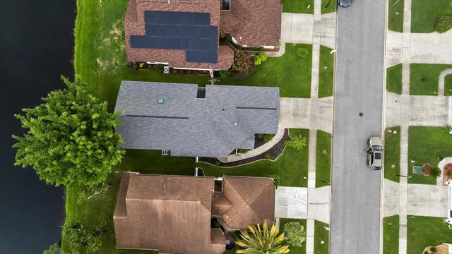 an aerial view of a house with a garden and plants