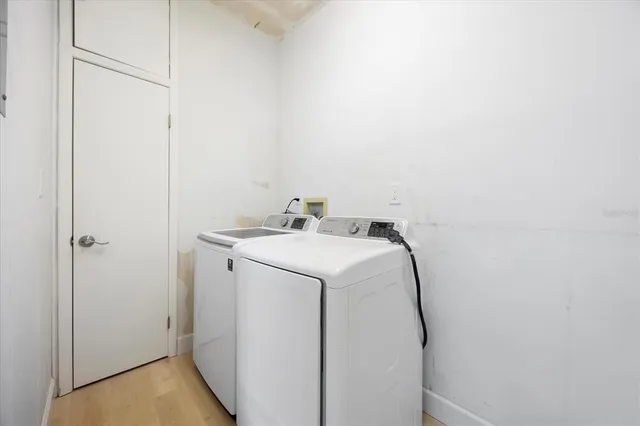 a utility room with dryer and washer