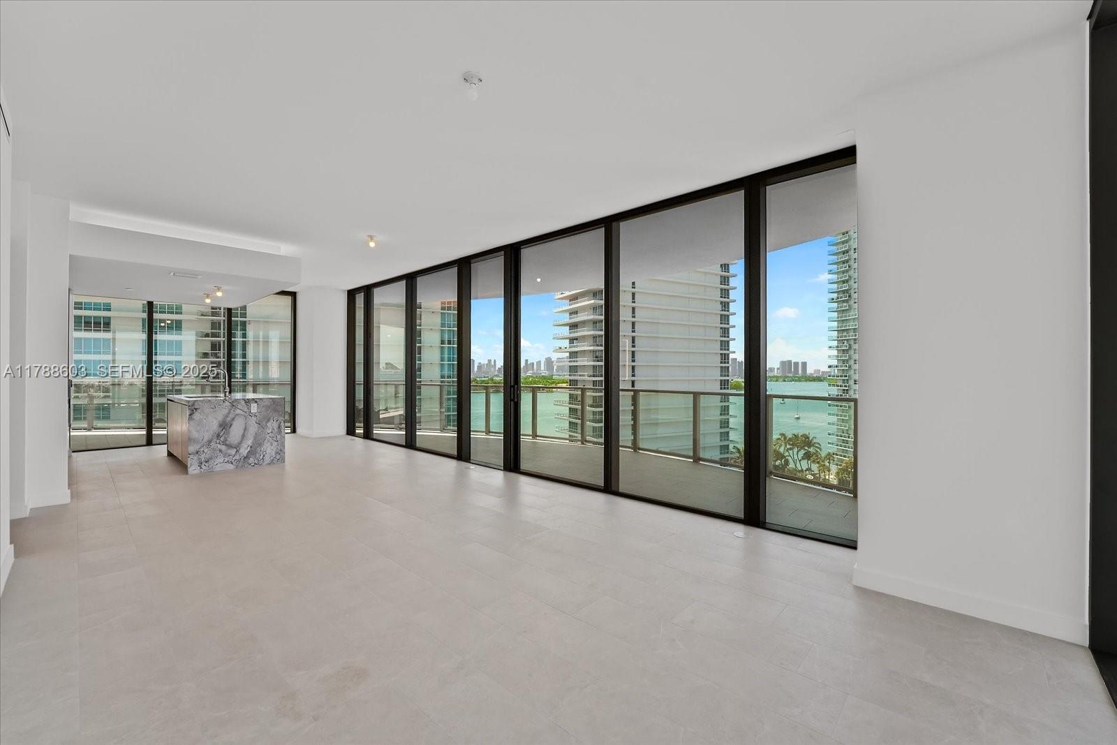 500 Alton Road, Unit 1105 Miami Beach, FL 33139 - Photo 15 of 69 a view of an empty room with windows and a balcony