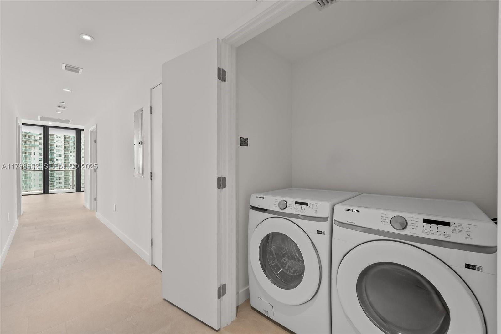 500 Alton Road, Unit 1105 Miami Beach, FL 33139 - Photo 27 of 69 a view of storage and utility room with washer and dryer