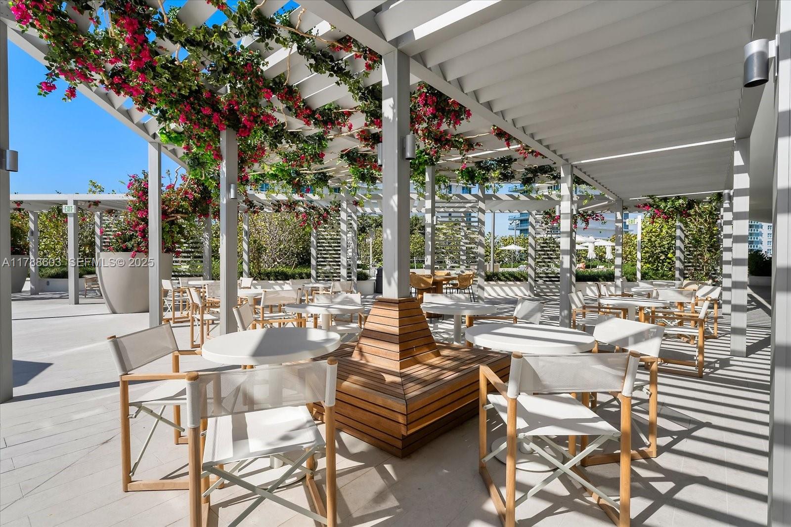 500 Alton Road, Unit 1105 Miami Beach, FL 33139 - Photo 56 of 69 a view of a patio with couches table and chairs and potted plants