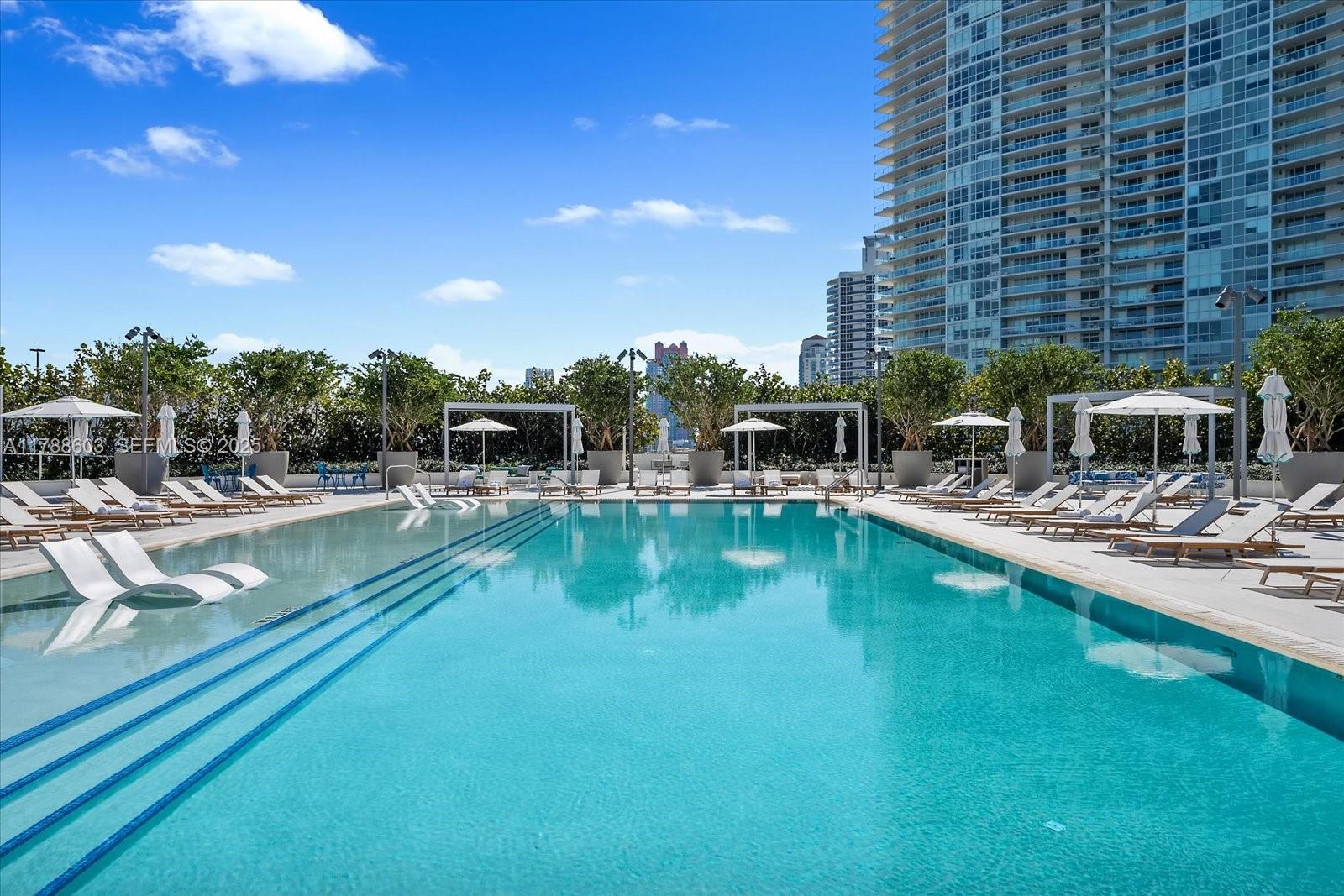 500 Alton Road, Unit 1105 Miami Beach, FL 33139 - Photo 58 of 69 a swimming pool with outdoor seating and yard