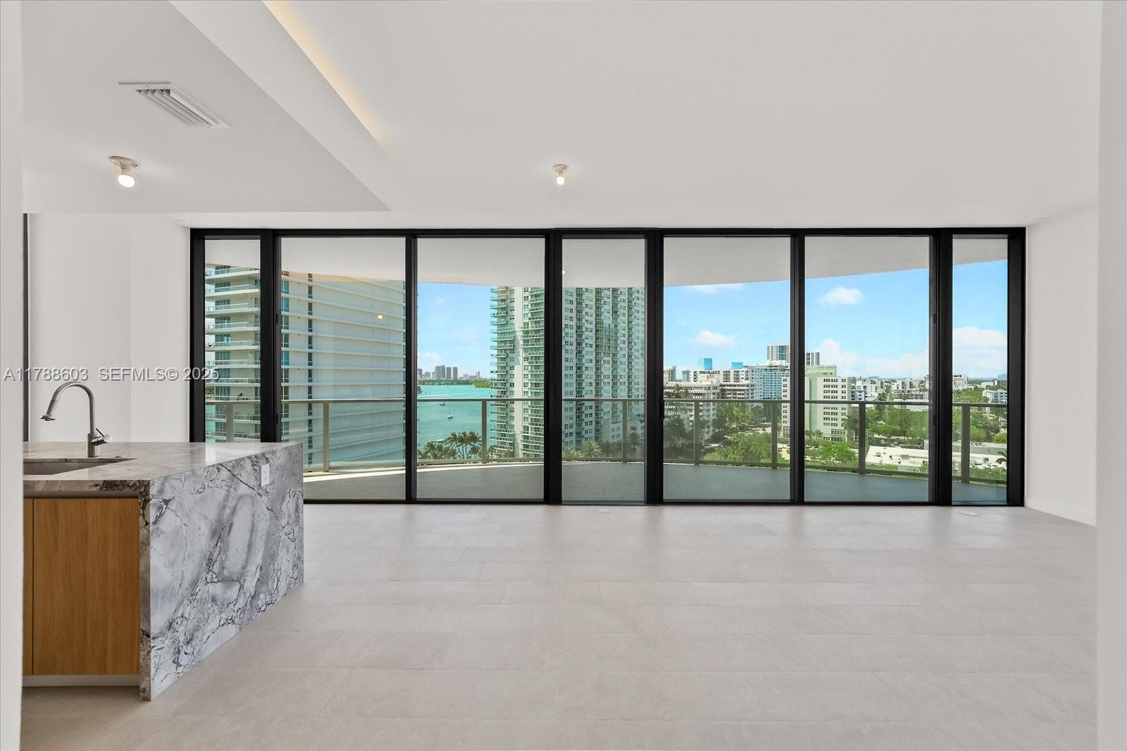 500 Alton Road, Unit 1105 Miami Beach, FL 33139 - Photo 6 of 69 a view of an empty room with a large window
