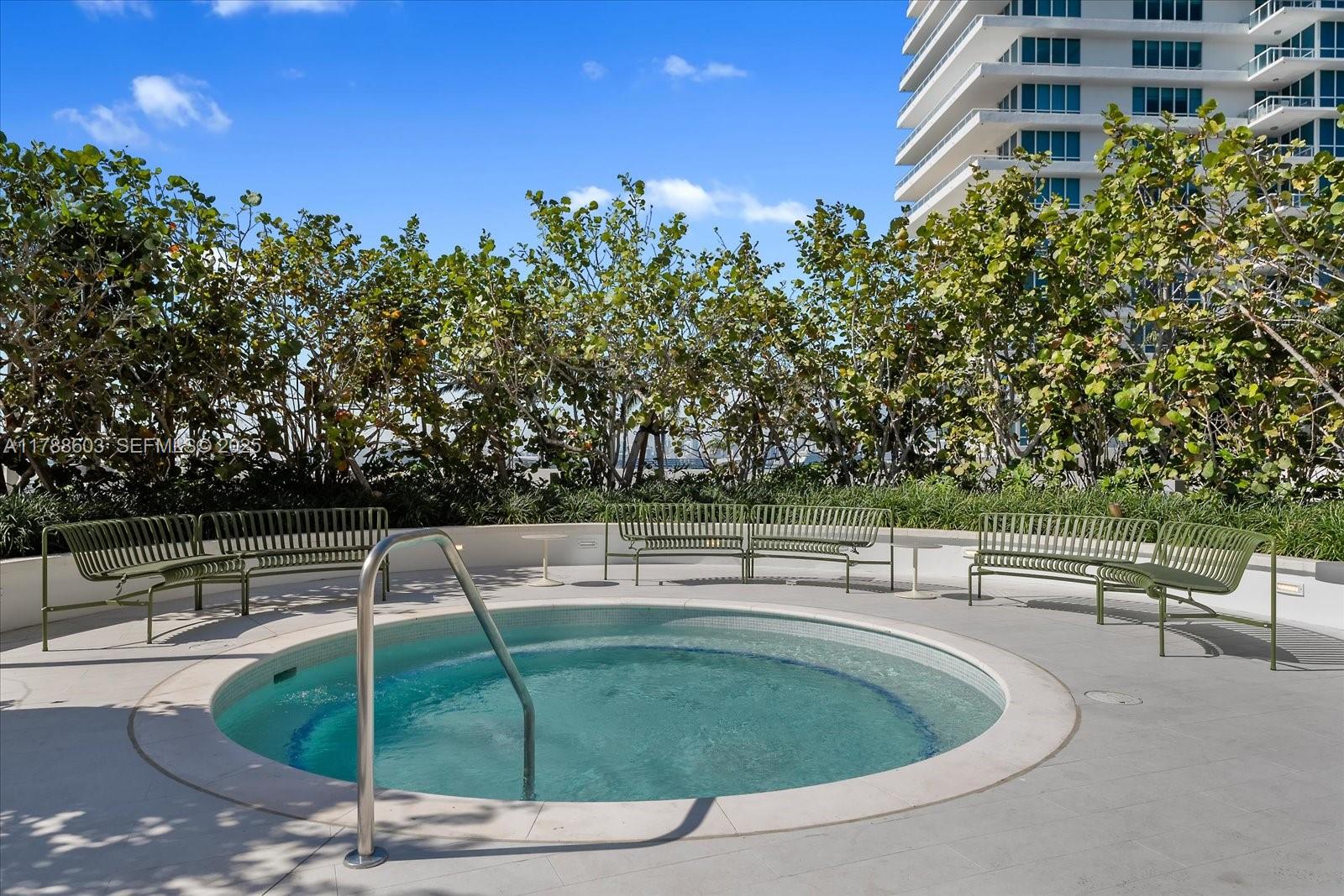 500 Alton Road, Unit 1105 Miami Beach, FL 33139 - Photo 61 of 69 a roof deck with table and chairs and potted plants