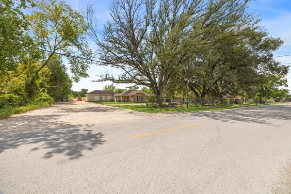 a view of road and trees