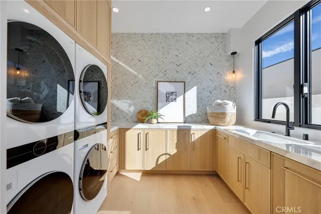a view of a hallway with washer and dryer
