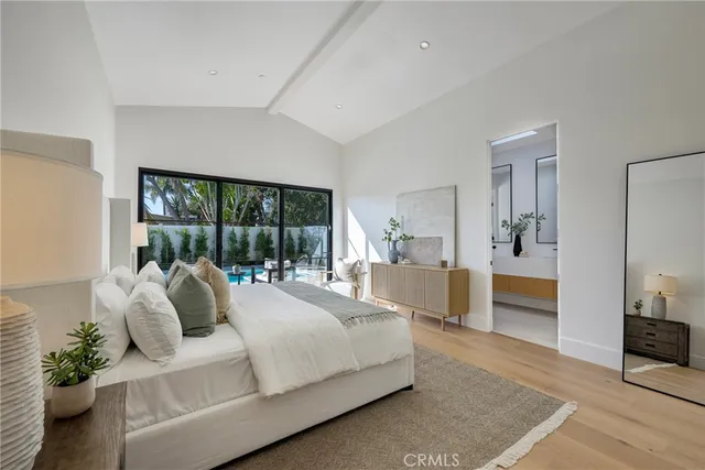 a bathroom with a double vanity sink mirror and shower