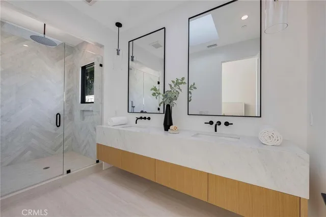 a bathroom with a tub sink and mirror