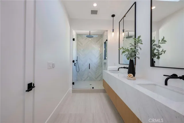 a bathroom with a toilet sink and shower