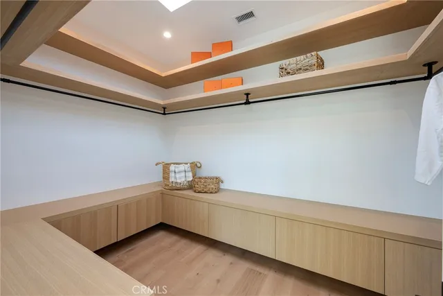 a bathroom with a double vanity sink mirror and shower