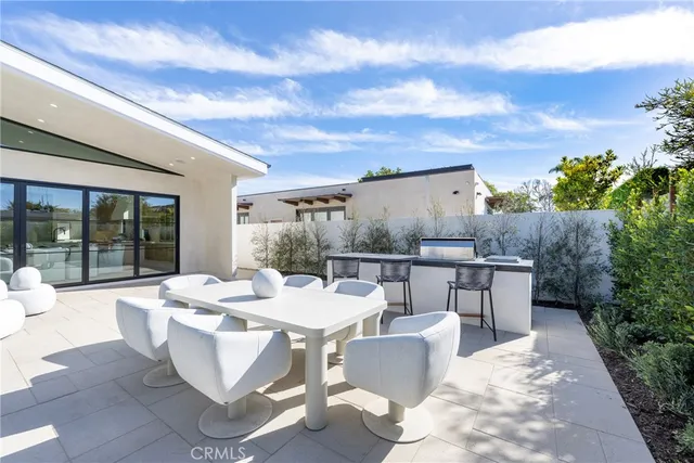 a dining room with a table and chairs