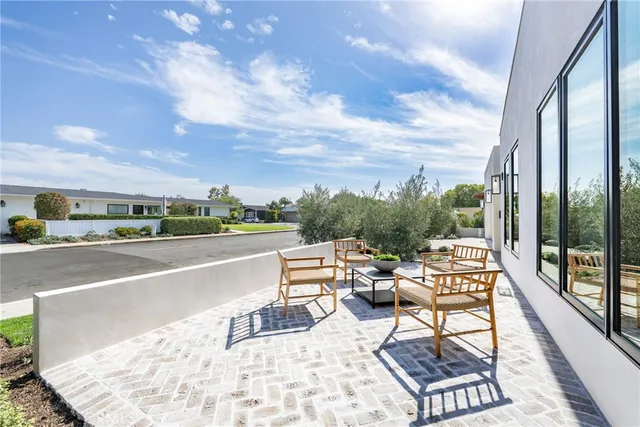 a view of balcony with couch and chairs