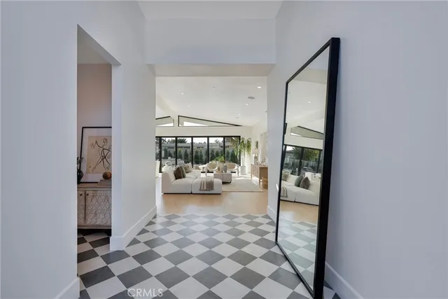 a bedroom with a bed and a mirror