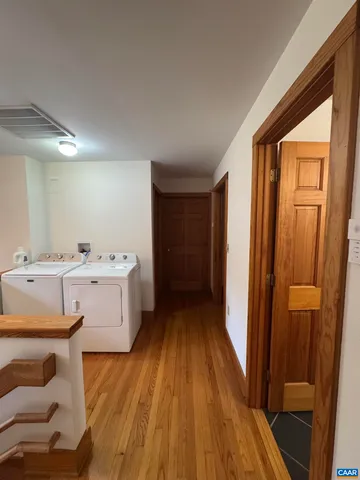 a view of a bathroom with a sink and a mirror