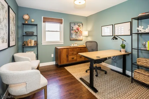 a workspace with furniture and window