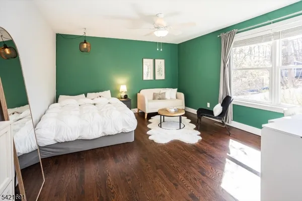 a bed room with furniture and a window