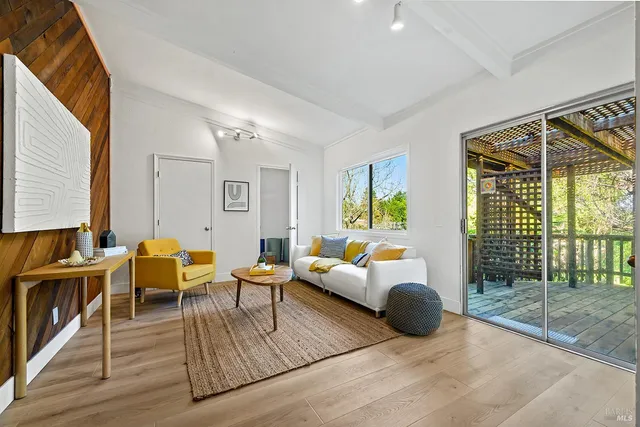 a bathroom with a bathtub shower sink mirror and toilet