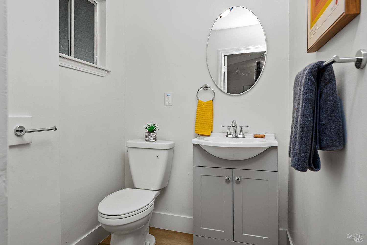 1417 Deer Lane Sebastopol, CA 95472 - Photo 19 of 66 a bathroom with a toilet sink and mirror