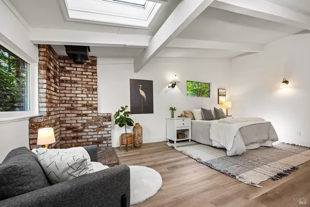 a view of green field with trees in the background