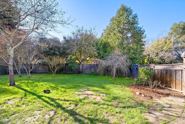 a view of a house with backyard porch and sitting area