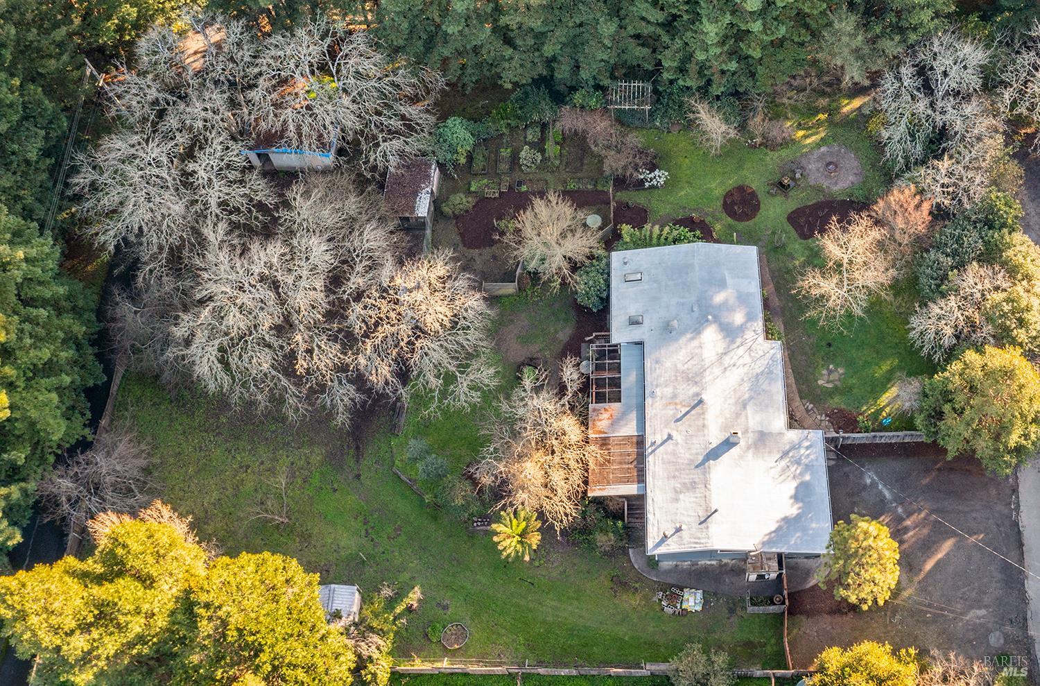 1417 Deer Lane Sebastopol, CA 95472 - Photo 62 of 66 an aerial view of a house with a yard and lake view