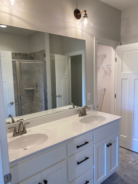 131 Flat Woods Road Lebanon, TN 37090 - Photo 13 of 25 a bathroom with a sink double vanity and a mirror