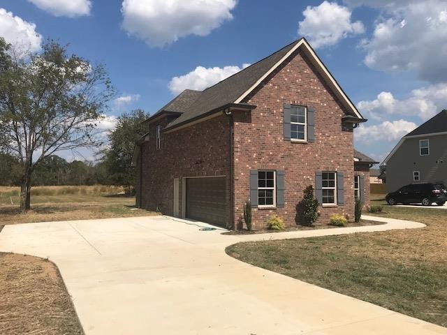 131 Flat Woods Road Lebanon, TN 37090 - Photo 3 of 25 a front view of a house with a yard
