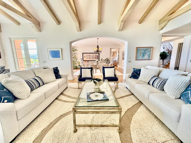 a living room with furniture and a book shelf