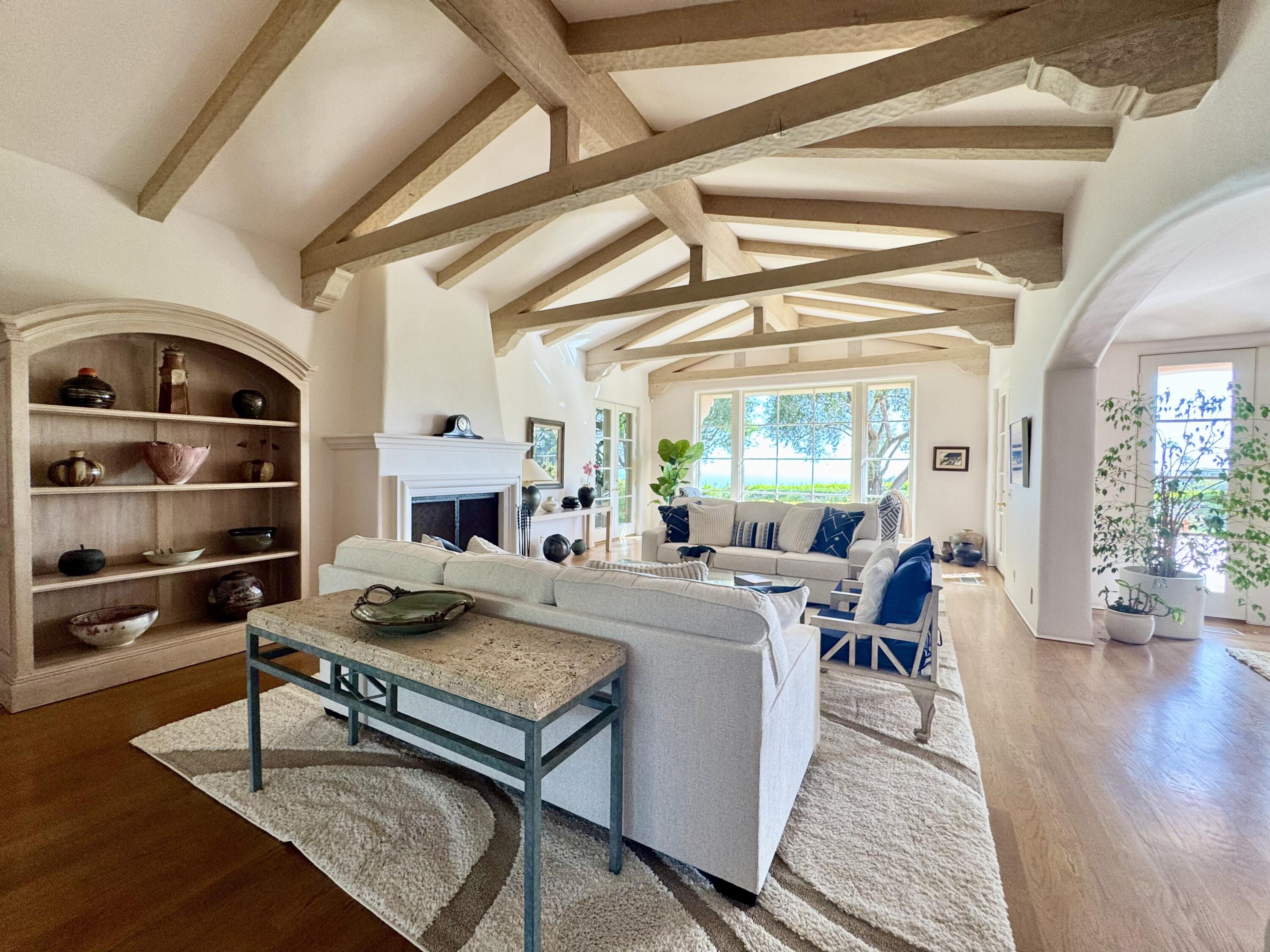 2240 Ortega Ranch Road Summerland, CA 93067 - Photo 13 of 87 a living room with furniture a fireplace and wooden floor