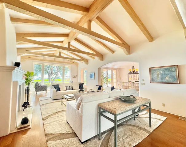 a spacious bedroom with a bed and a table