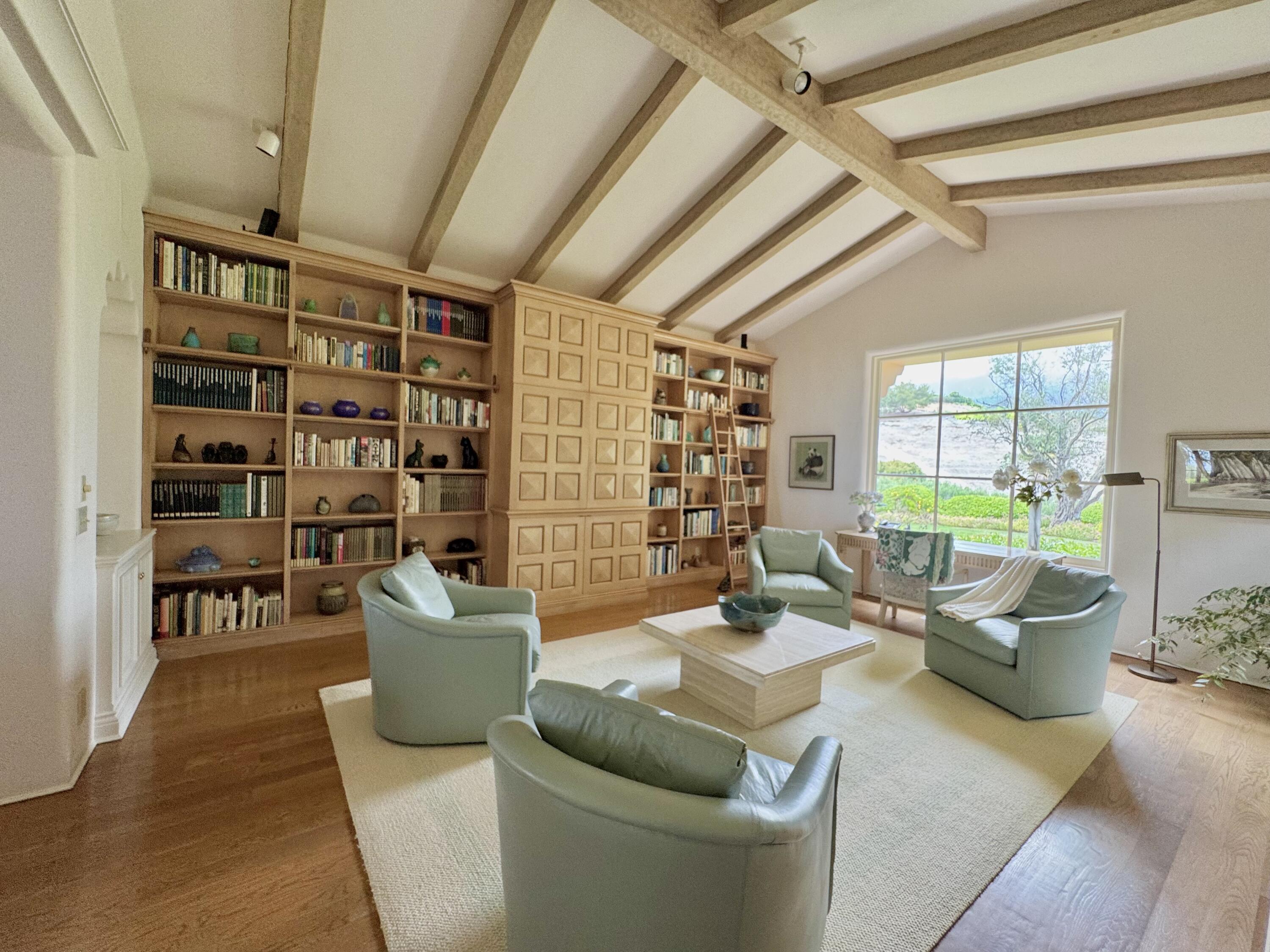 2240 Ortega Ranch Road Summerland, CA 93067 - Photo 16 of 87 a living room with furniture and a book shelf