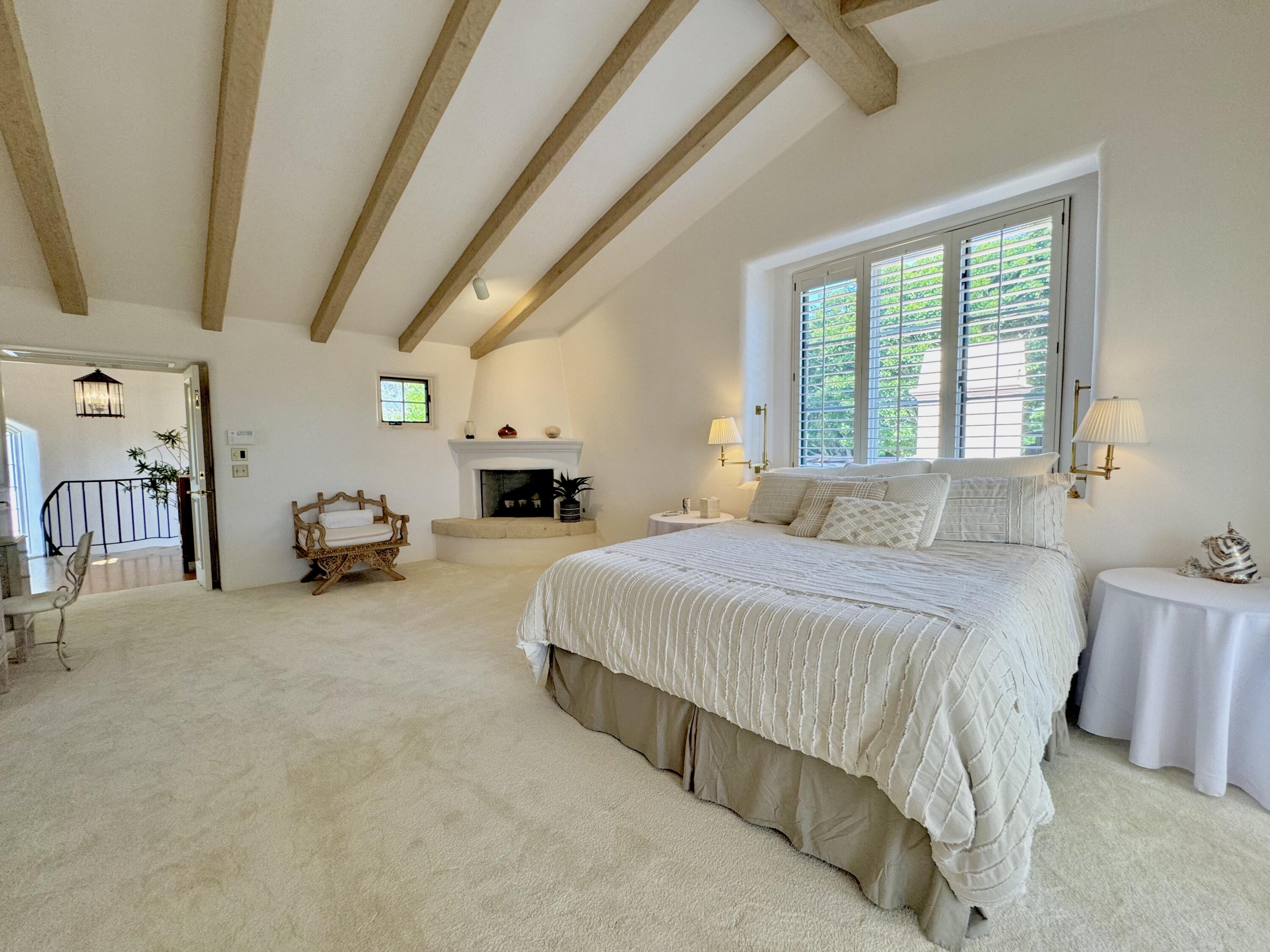2240 Ortega Ranch Road Summerland, CA 93067 - Photo 21 of 87 a spacious bedroom with a bed and a table